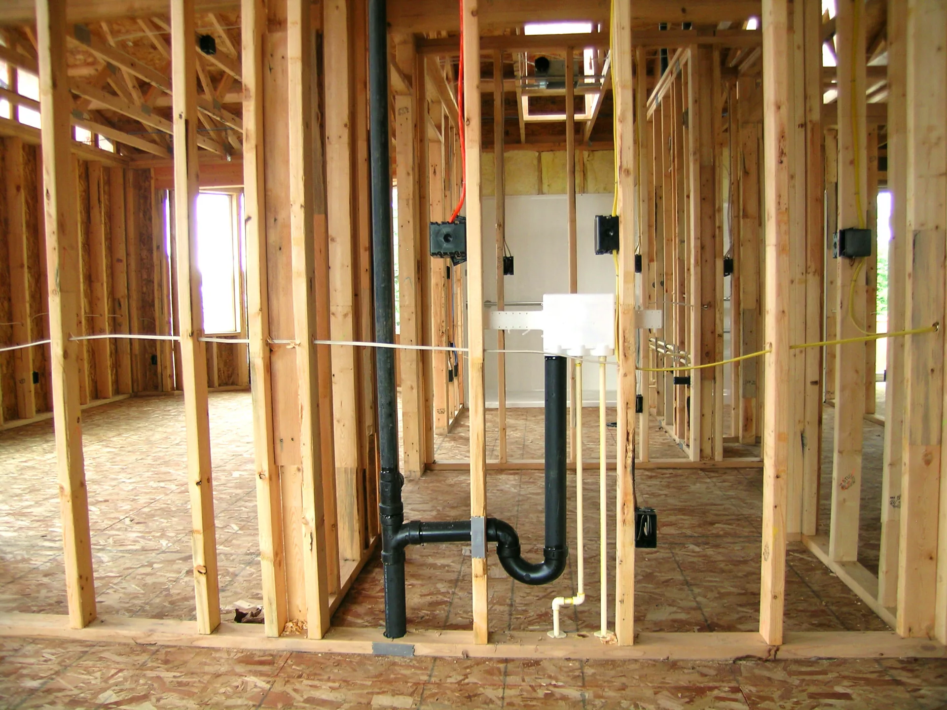 Toilet and sink stack out plumbing in a newly framed home in Maricopa County