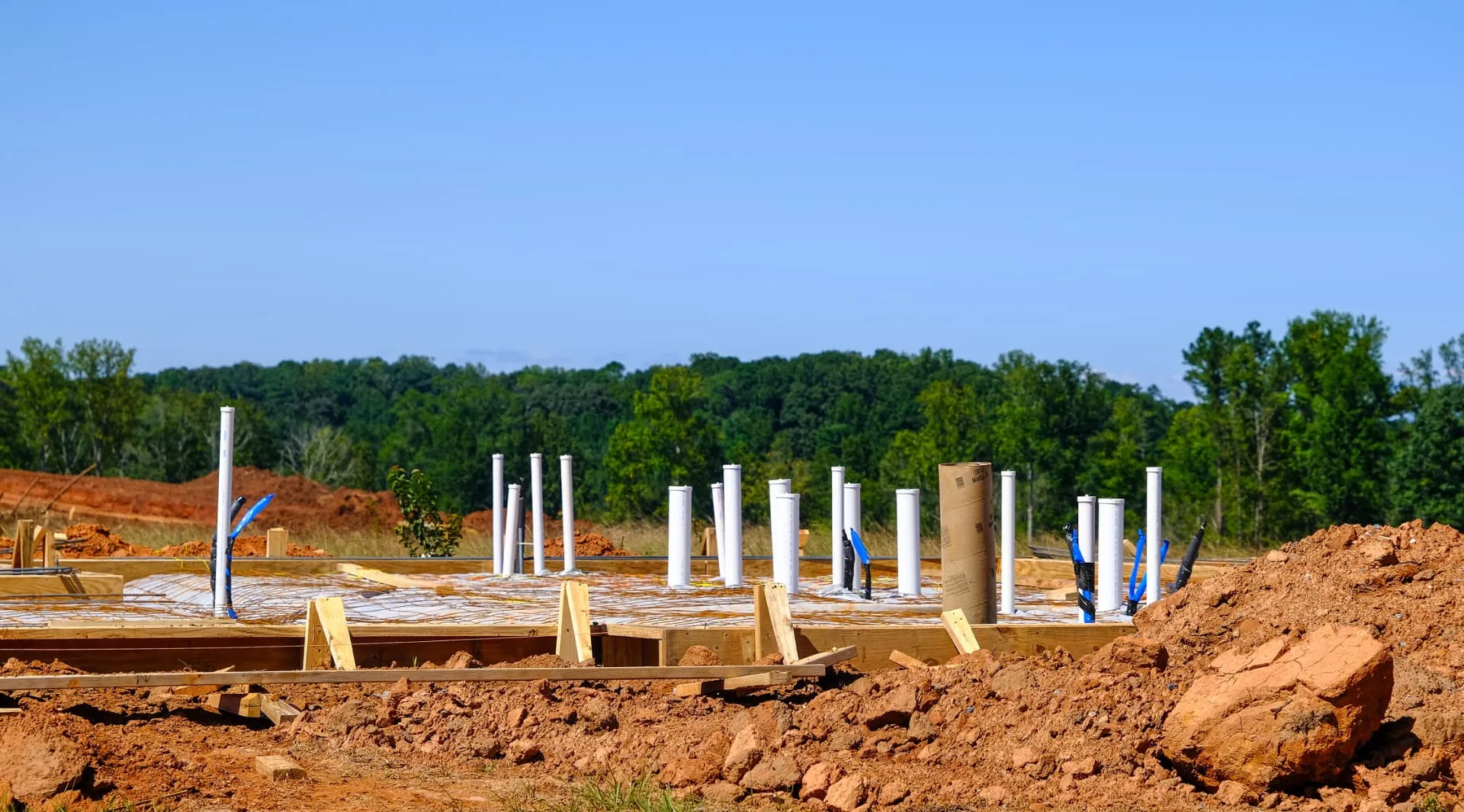 Plumbing stub outs set on a new home slab in Wickenburg, AZ